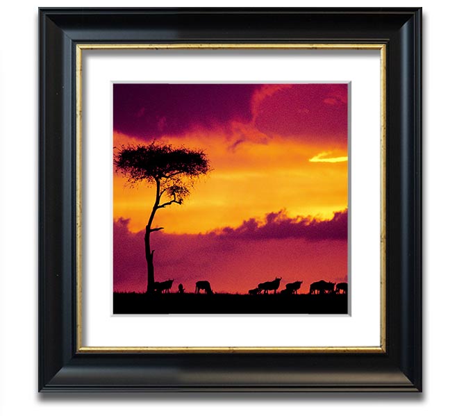 A beautifully framed print of an African sunset, showcasing vibrant colors and serene landscapes, ready to hang.