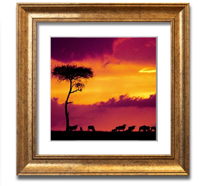 A beautifully framed print of an African sunset, showcasing vibrant colors and serene landscapes, ready to hang.