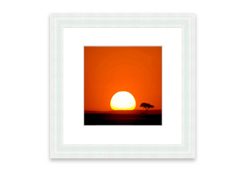 A beautifully framed print of an African sunrise, showcasing vibrant colors and serene landscape, ready to hang.