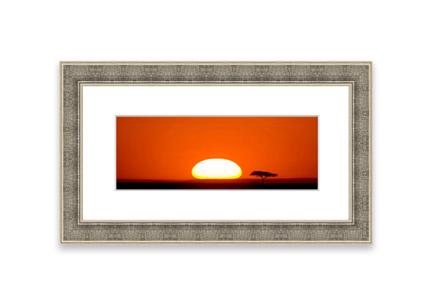 A beautifully framed print of an African sunrise, showcasing vibrant colors and serene landscape, ready to hang.