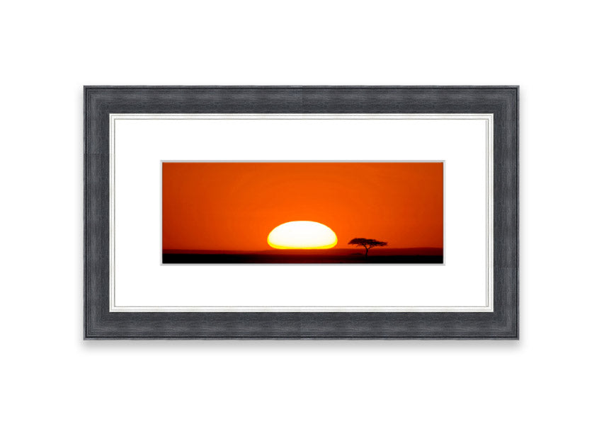 A beautifully framed print of an African sunrise, showcasing vibrant colors and serene landscape, ready to hang.