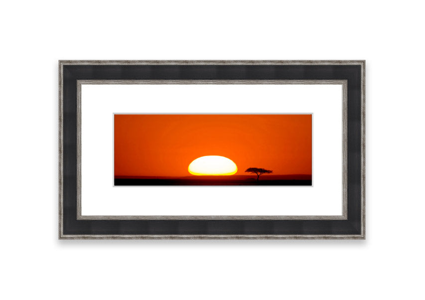 A beautifully framed print of an African sunrise, showcasing vibrant colors and serene landscape, ready to hang.
