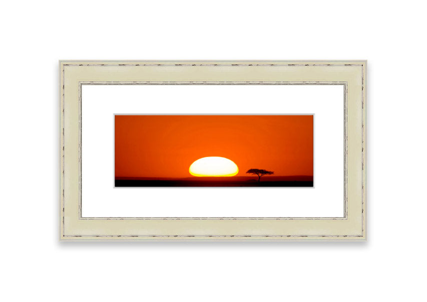 A beautifully framed print of an African sunrise, showcasing vibrant colors and serene landscape, ready to hang.