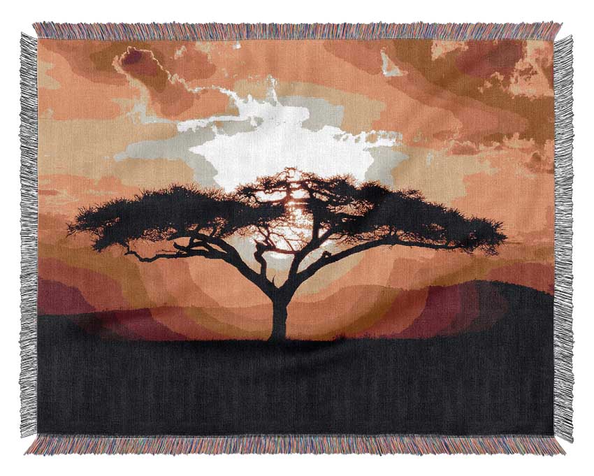 A luxurious 100% cotton throw featuring an African tree design at sunset, perfect for home decor.