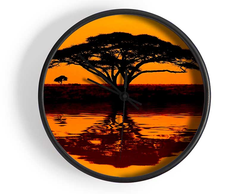 African Tree Reflection clock made from natural bamboo with a round face and clear Plexiglas lens, available in multiple colors.