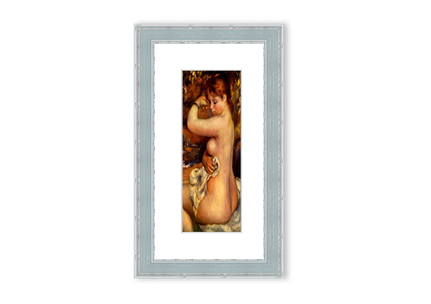 Framed print of Renoir's 'After The Bath', showcasing serene beauty and vibrant colors.