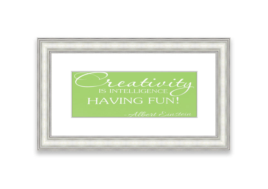 Framed print featuring Albert Einstein's quote 'Creativity Is Intelligence' in vibrant lime green, ready to hang.