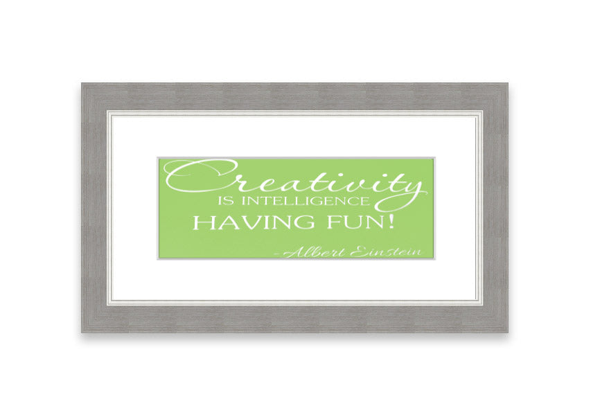 Framed print featuring Albert Einstein's quote 'Creativity Is Intelligence' in vibrant lime green, ready to hang.