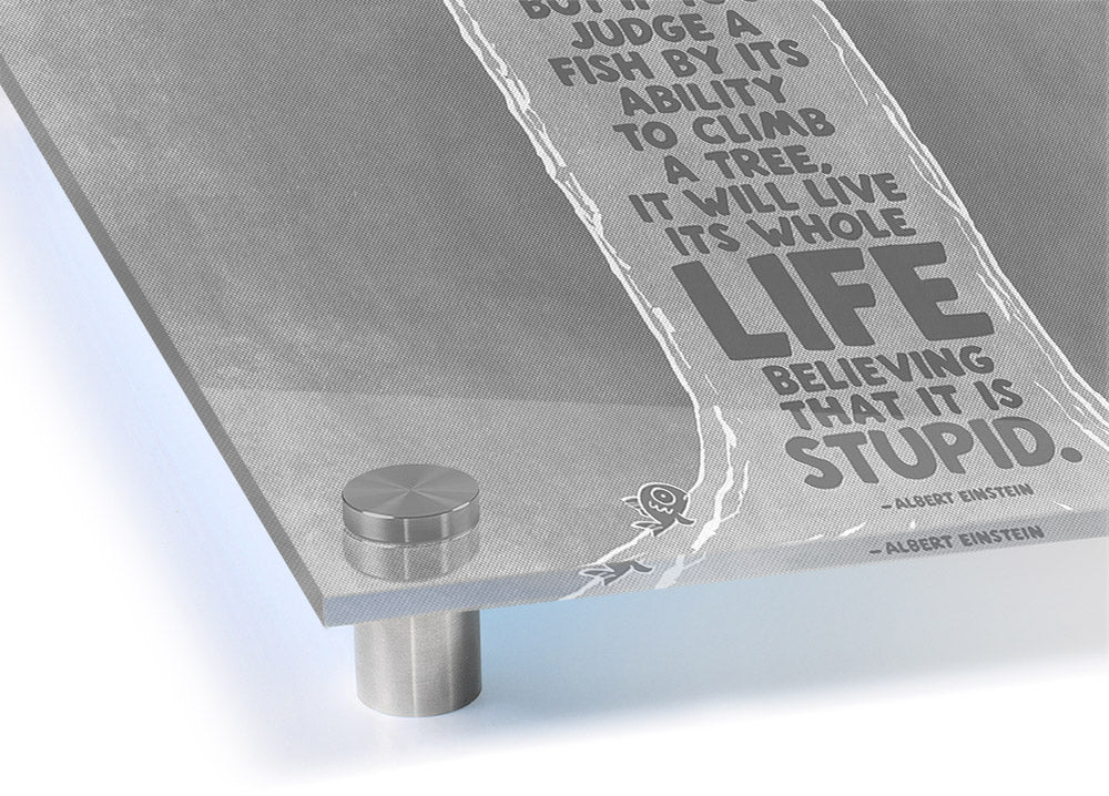 Albert Einstein Everybody Is A Genius Grey acrylic print on a wall, showcasing vibrant colors and modern design.