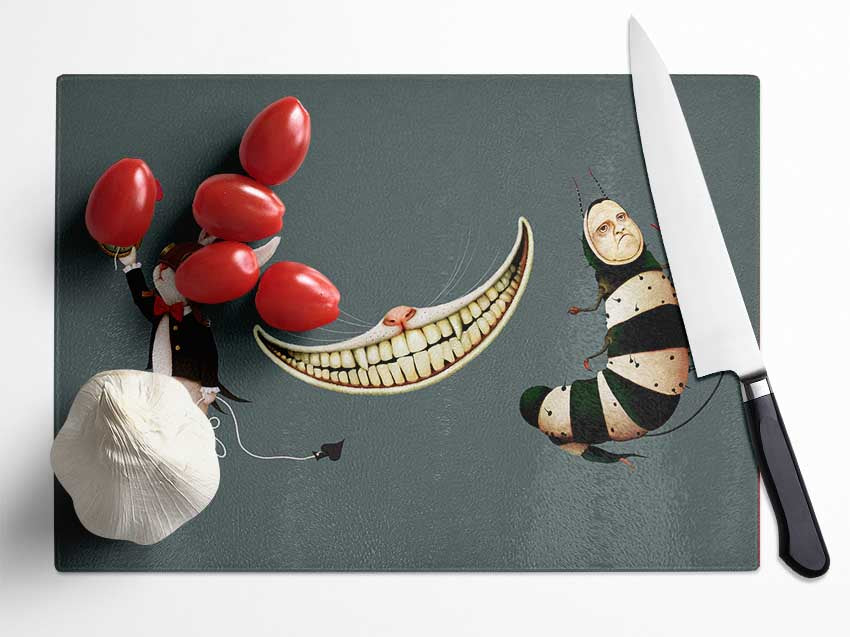 Alice In Wonderland themed chopping board featuring a rabbit, cat, and caterpillar design on tempered glass.