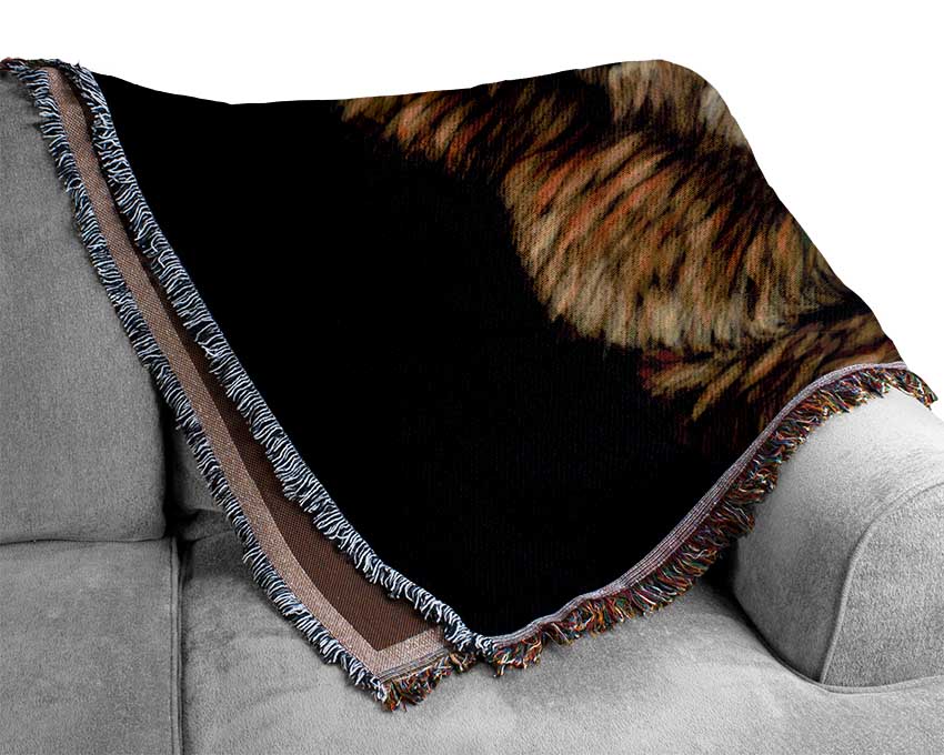 A luxurious Alpaca Up Close throw blanket made from 100% cotton, featuring a thermal weave design, draped elegantly on a couch.