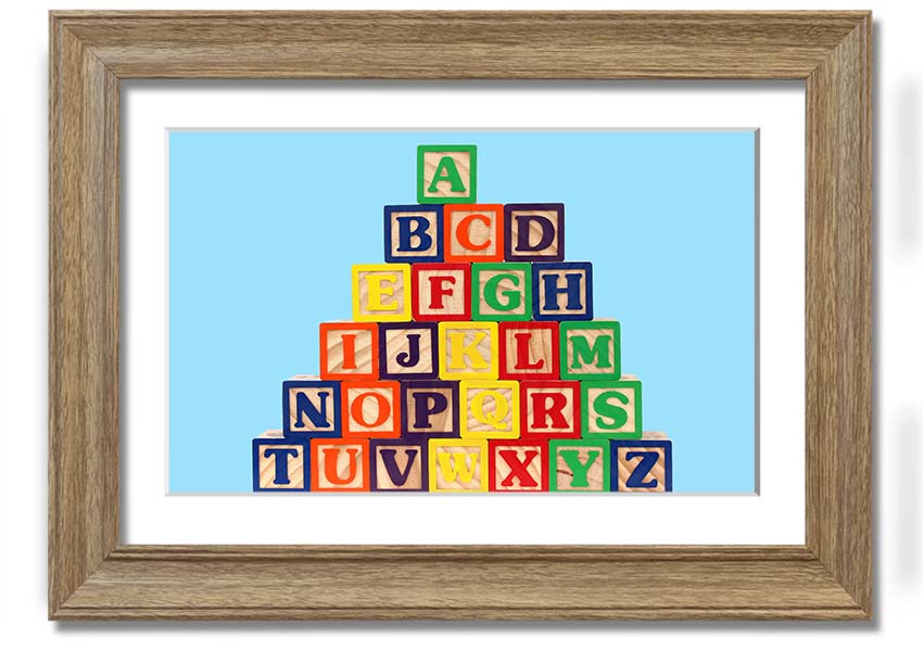 Framed print of Alphabet Blocks in baby blue, showcasing letters in a playful design, ready to hang.