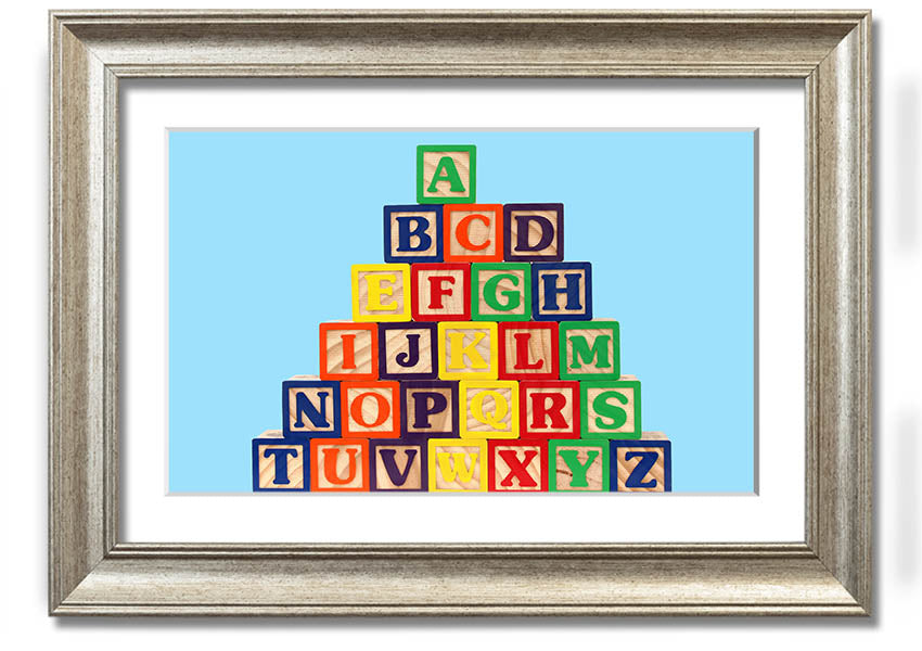 Framed print of Alphabet Blocks in baby blue, showcasing letters in a playful design, ready to hang.