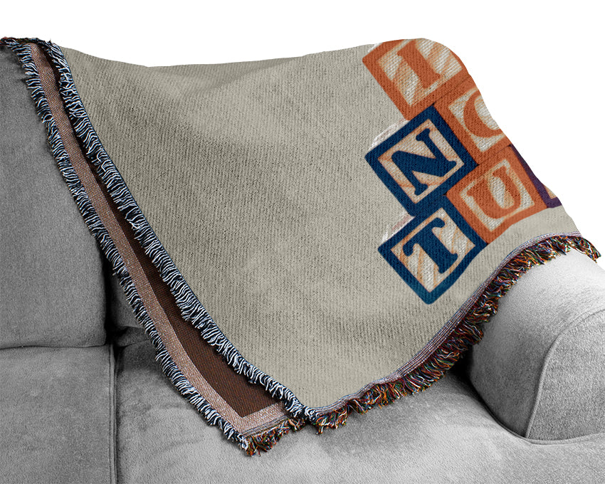 A soft lilac throw blanket made from 100% cotton, featuring a thermal weave design, perfect for adding elegance to any room.