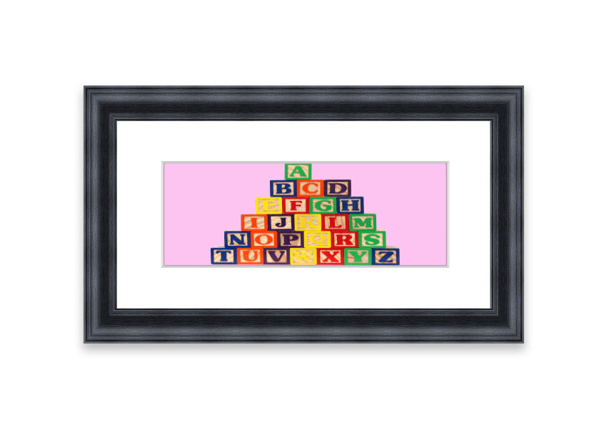 A charming pink framed print featuring colorful alphabet blocks, perfect for children's rooms.