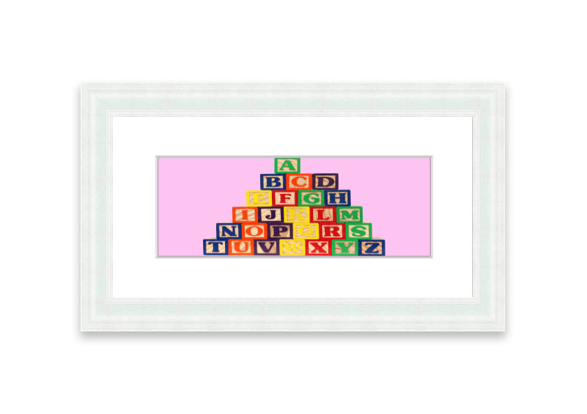 A charming pink framed print featuring colorful alphabet blocks, perfect for children's rooms.