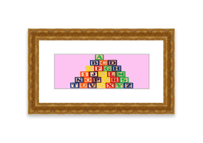 A charming pink framed print featuring colorful alphabet blocks, perfect for children's rooms.