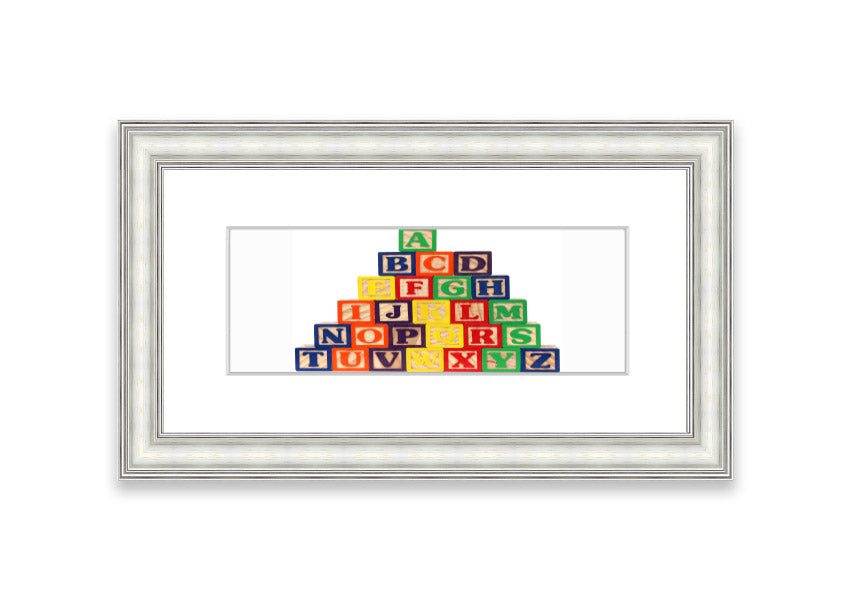 Framed Alphabet Blocks White print showcasing colorful letters, perfect for nursery decor.