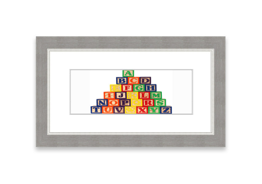 Framed Alphabet Blocks White print showcasing colorful letters, perfect for nursery decor.