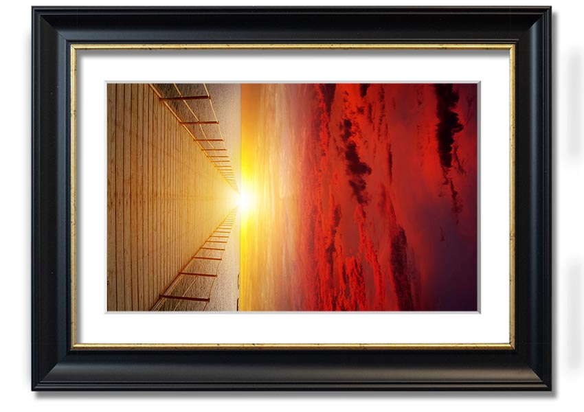 A beautifully framed print of a sunset over a boardwalk, showcasing vibrant colors and serene scenery.