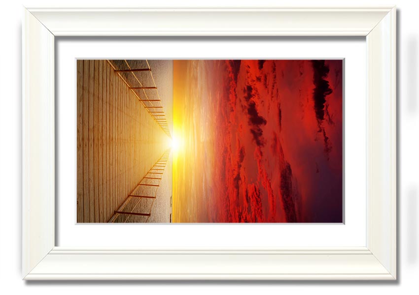 A beautifully framed print of a sunset over a boardwalk, showcasing vibrant colors and serene scenery.