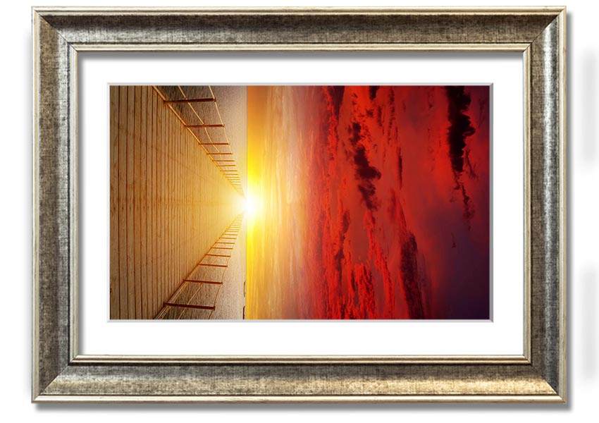 A beautifully framed print of a sunset over a boardwalk, showcasing vibrant colors and serene scenery.