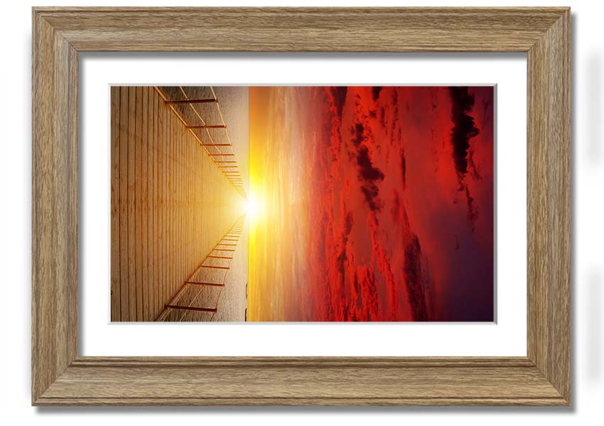 A beautifully framed print of a sunset over a boardwalk, showcasing vibrant colors and serene scenery.