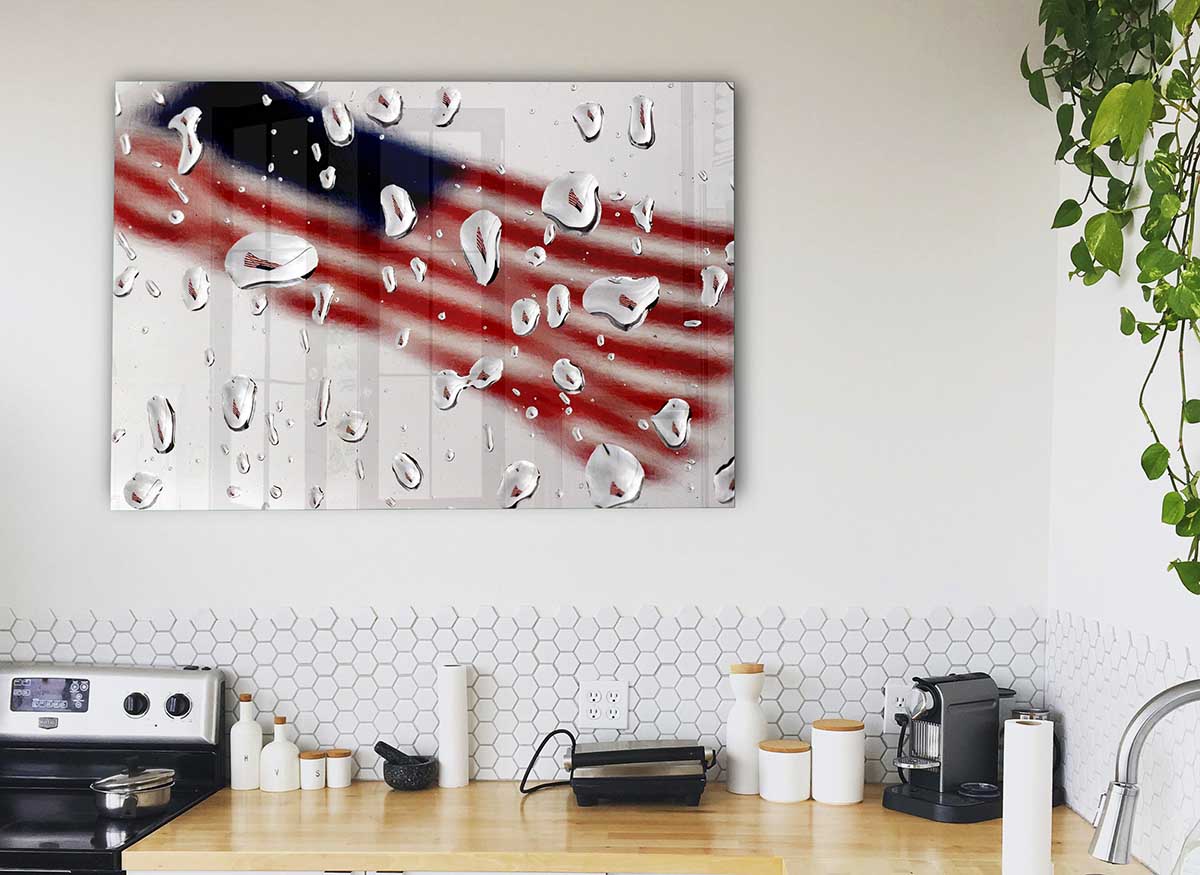 A modern glass print featuring the American flag in a droplet shape, showcasing vibrant colors and contemporary design.
