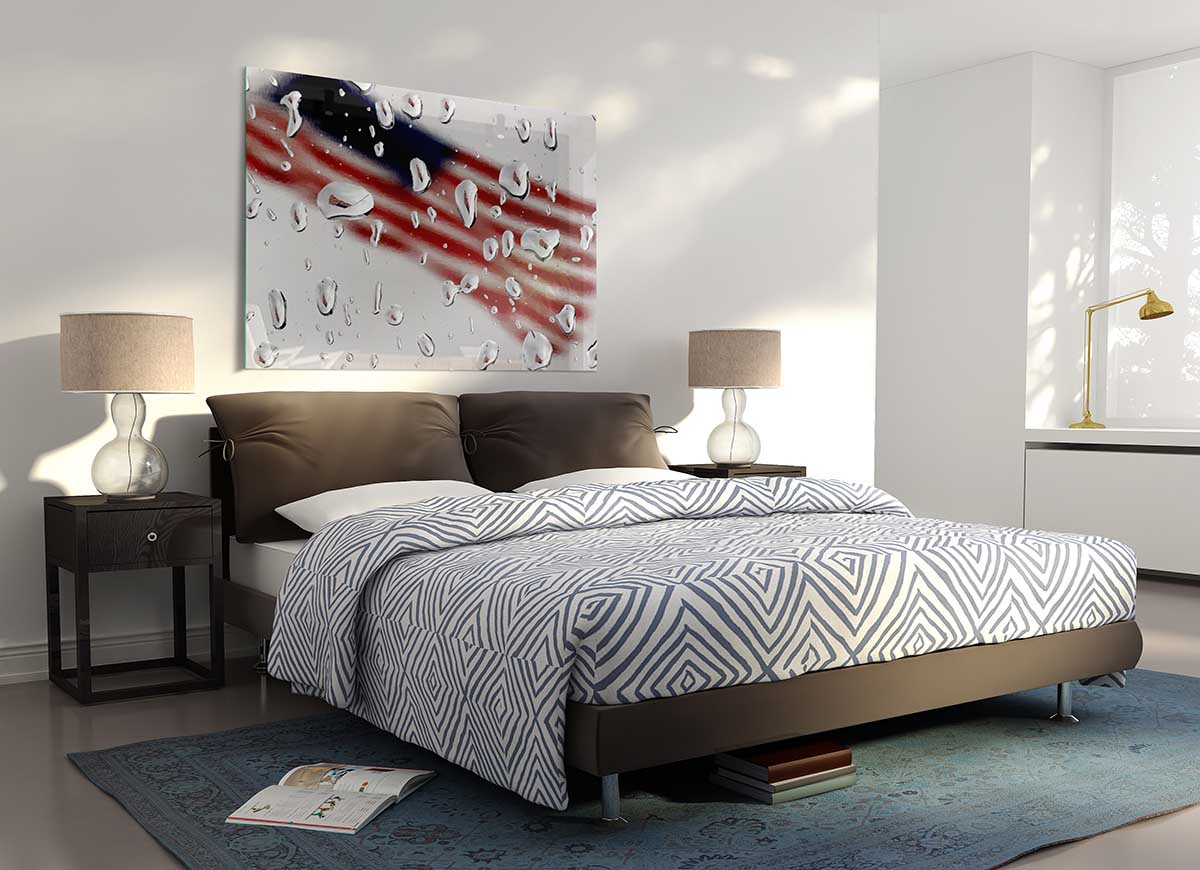 A modern glass print featuring the American flag in a droplet shape, showcasing vibrant colors and contemporary design.