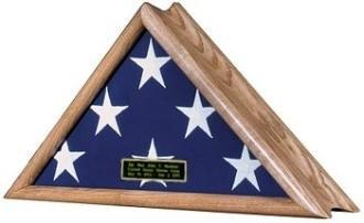 American Patriot Flag Display Case with oak finish, featuring a glass front and serpentine profile, designed to hold a large American flag.
