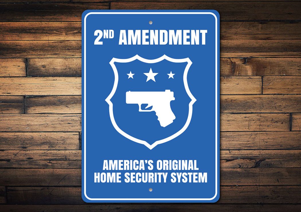 America's Original Home Security System Sign made of durable aluminum, featuring customizable text and pre-drilled holes for easy mounting.
