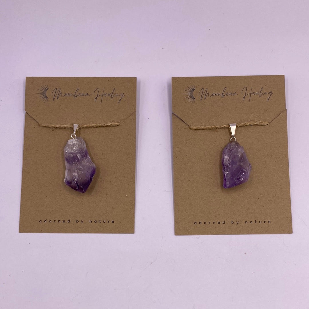 A beautiful Amethyst Rough Cut Pendant showcasing its unique natural shape and vibrant purple hues, symbolizing healing and positive energy.