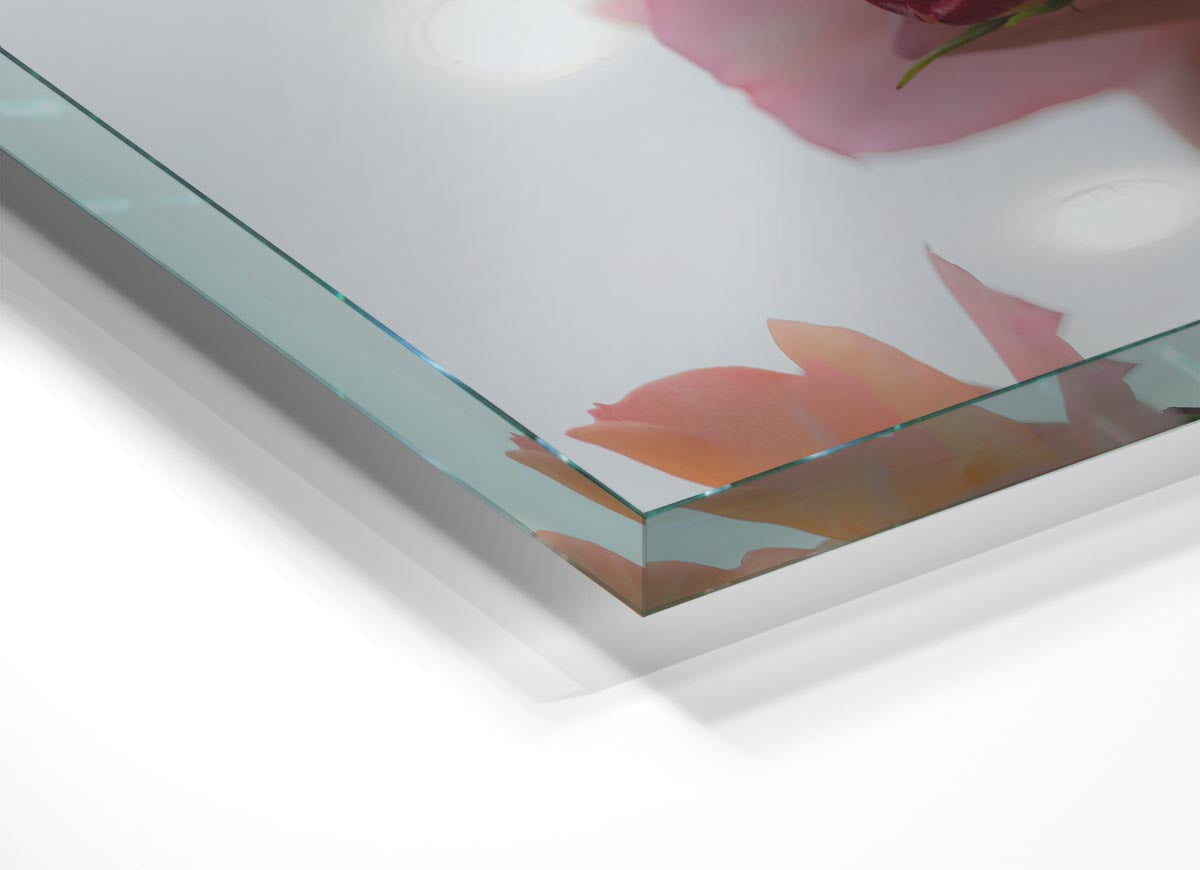 A modern glass print featuring an array of vibrant pink flowers, perfect for home decor.