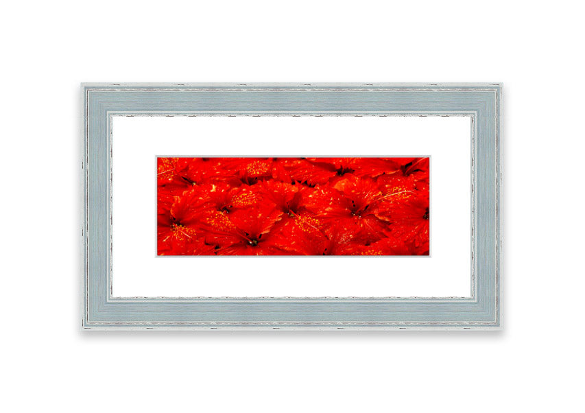 Framed print of vibrant red leaves, showcasing autumn colors, ready to hang.