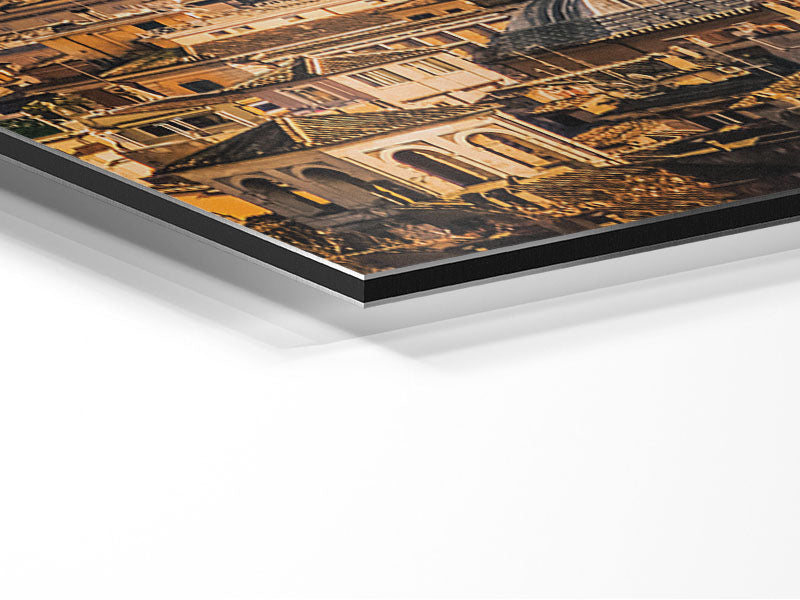 A stunning artwork of ancient buildings illuminated by a vibrant sunset, printed on brushed aluminium dibond.