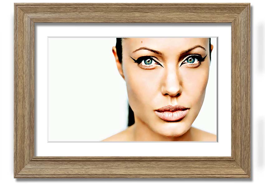 Framed print of Angelina Jolie with cat eyes, showcasing her iconic beauty in a stylish frame.