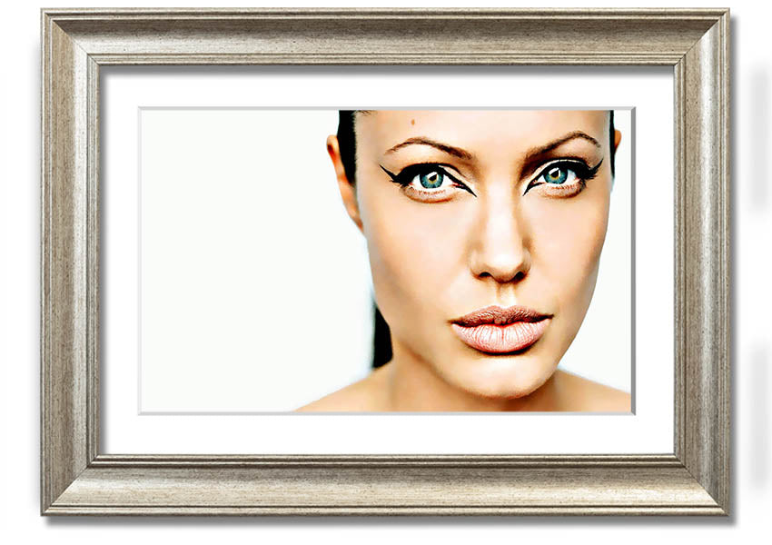 Framed print of Angelina Jolie with cat eyes, showcasing her iconic beauty in a stylish frame.