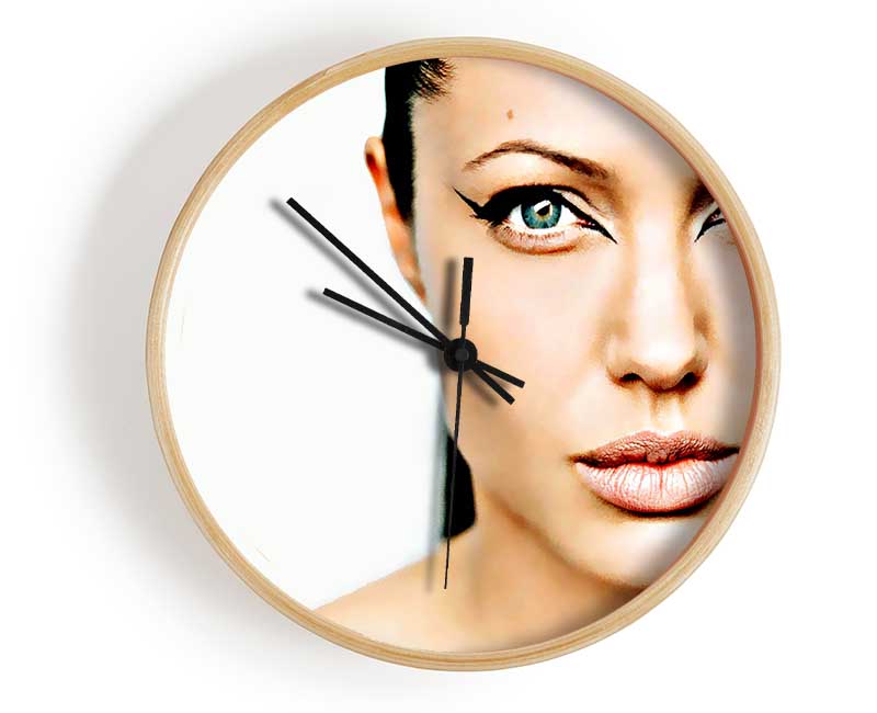 Angelina Jolie Cat Eyes clock made from natural bamboo with a round face and clear Plexiglas lens, available in black, white, and natural frame colors.