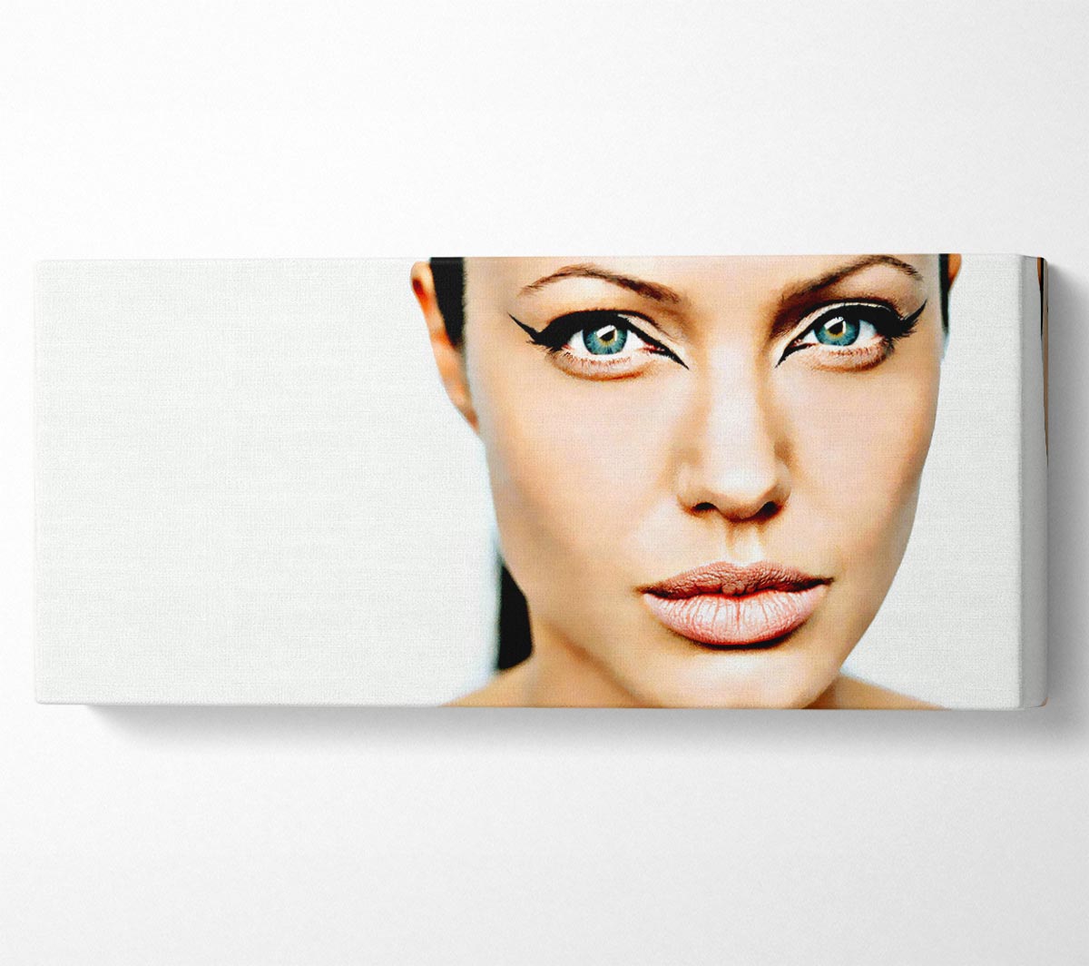 Canvas art featuring Angelina Jolie's iconic cat eyes, mounted on a 44mm box frame, ready to hang.
