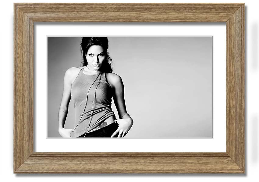 Framed black and white print of Angelina Jolie, showcasing her elegance and beauty, available in various frame colors.