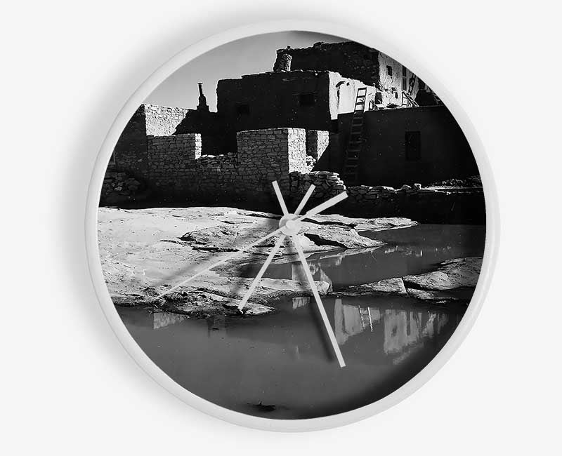 Ansel Adams Acoma Pueblo 3 clock made of natural bamboo with a round face and clear Plexiglas lens, available in black, white, and natural frame colors.