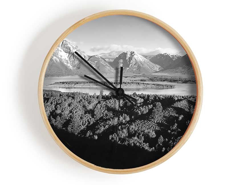 Ansel Adams Signal Hill clock made of natural bamboo with a round face, featuring black and white hands, and a clear Plexiglas lens.