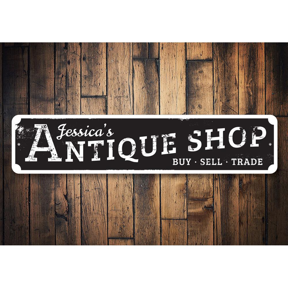 A beautifully crafted antique shop sign made of high-quality aluminum, featuring customizable text and pre-drilled holes for easy mounting.