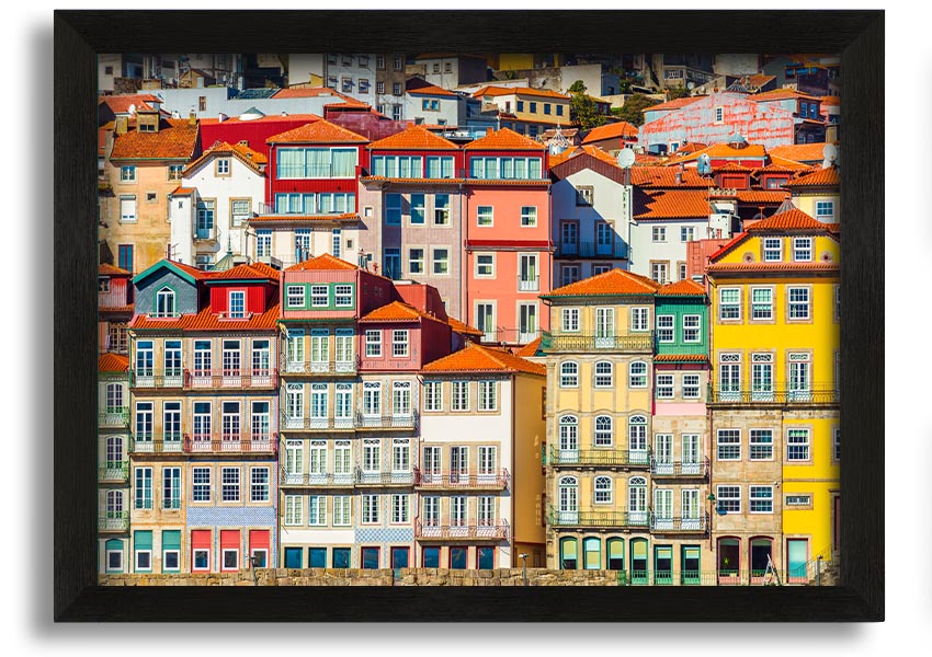 A beautifully framed print of coastal apartments, showcasing vibrant colors and intricate details, ready to hang on the wall.