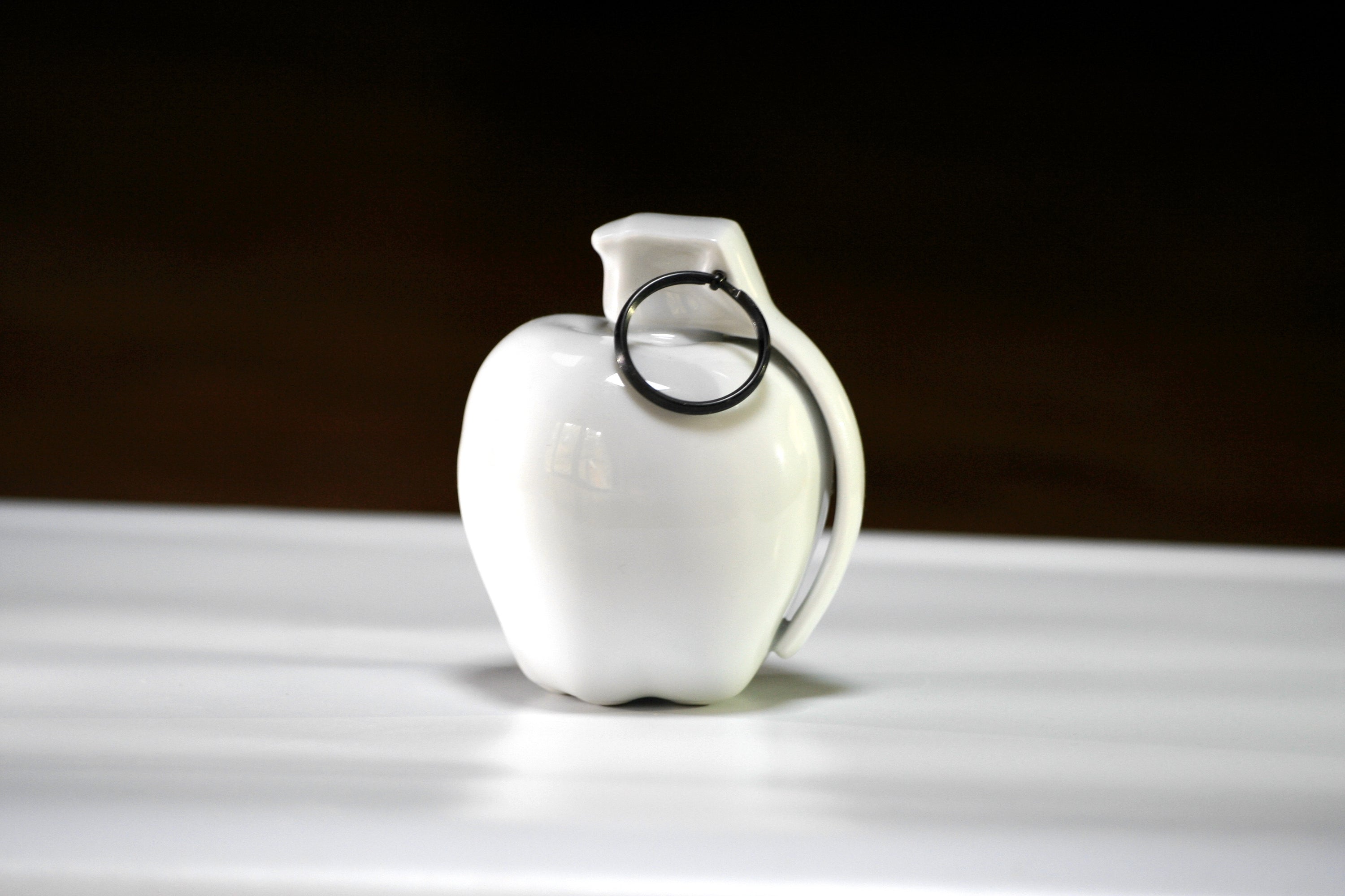 White apple-shaped ceramic grenade
