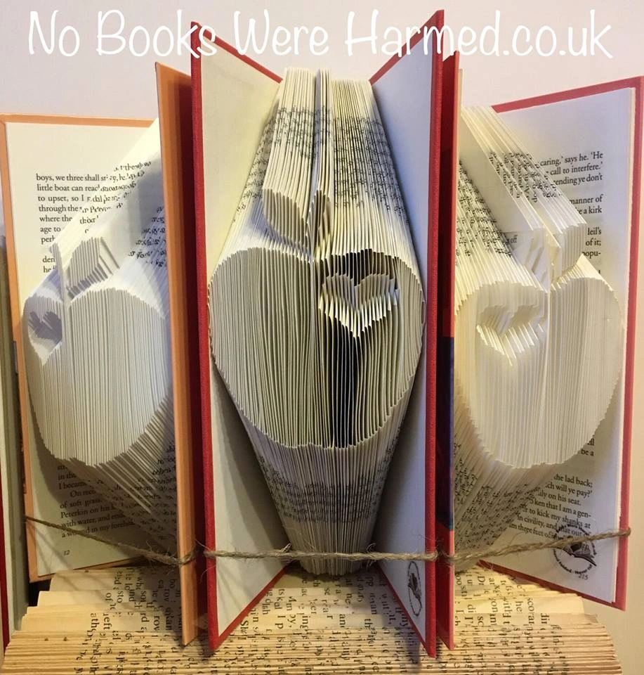 Handcrafted apple art made from vintage book pages, symbolizing appreciation for teachers.