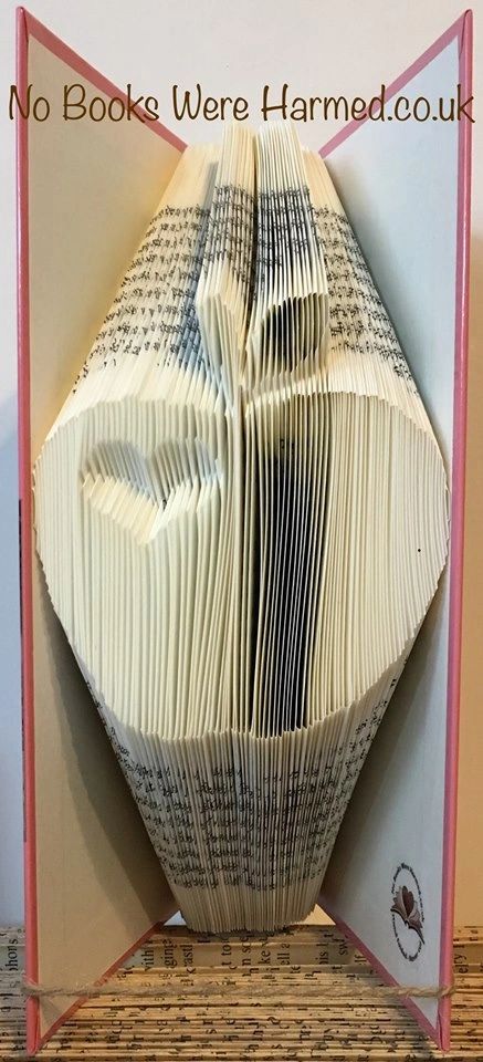 Handcrafted apple art made from vintage book pages, symbolizing appreciation for teachers.