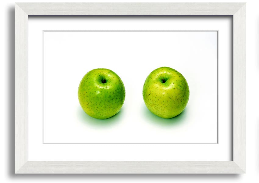 A beautifully framed print of twin apples, showcasing vibrant colors and available in various frame options.