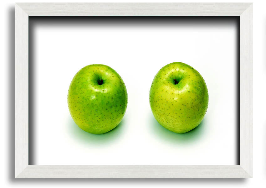 A beautifully framed print of twin apples, showcasing vibrant colors and available in various frame options.