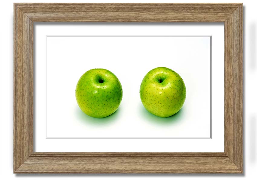 A beautifully framed print of twin apples, showcasing vibrant colors and available in various frame options.